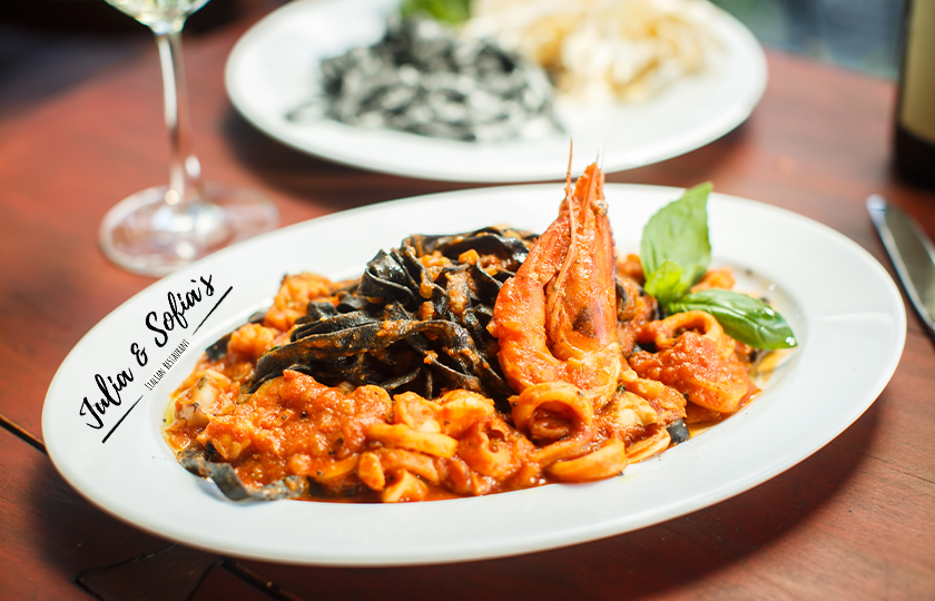 Authentic Italian pasta dish with wine served at Bistro Italiano in Durham